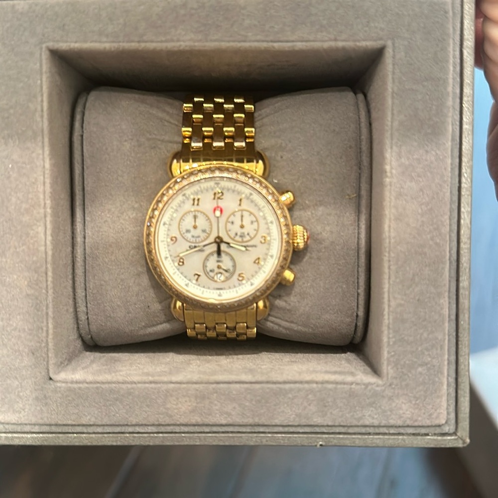 Gold tone MICHELE watch. Comes with original box. Retails for over 2300